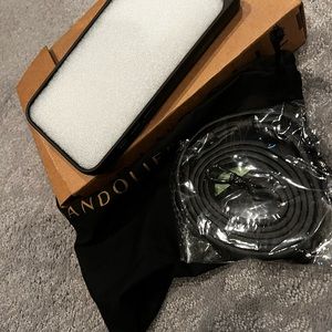 Brand new! Never used still in packaging. Bandolier phone case. White 13 pro